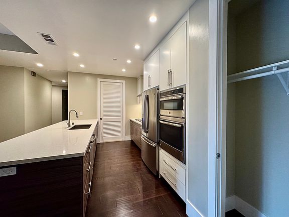 Kitchen (with Coat Closet on Right and Laundry/Pantry Space on Left)
