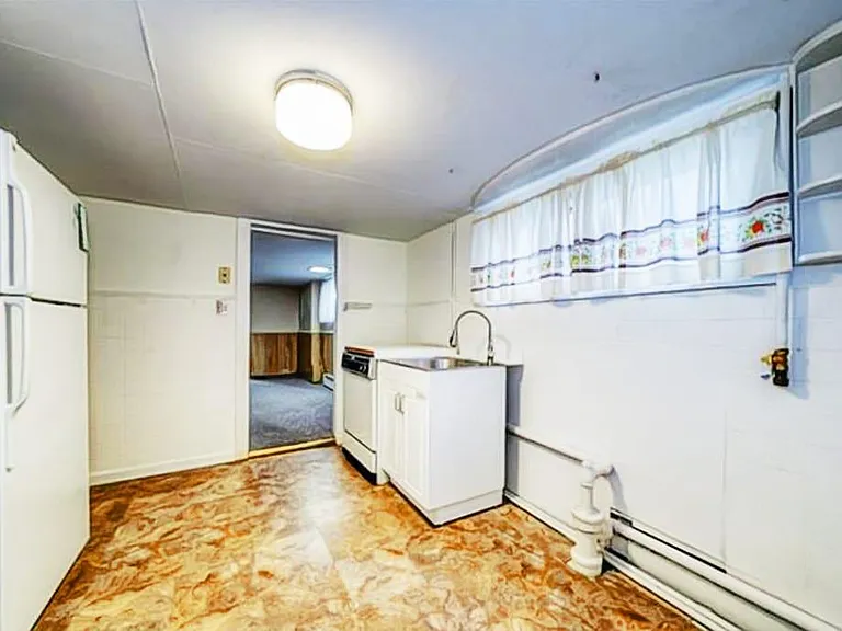 Basement storage area / Kitchen
