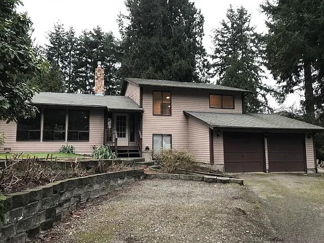front of house, driveway and additional parking space