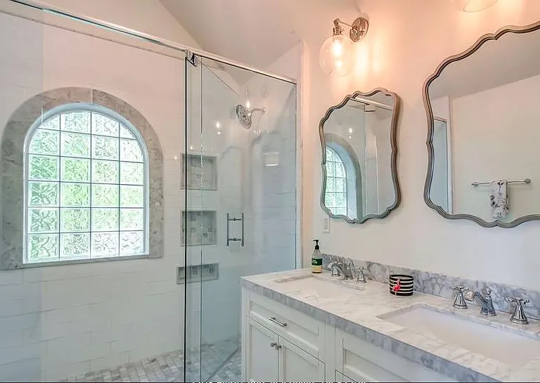 Upstairs bathroom- double sinks and walk in shower with double shower heads