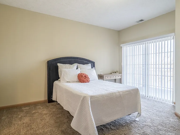 Some of our homes offer primary bedrooms with a door opening onto the balcony.