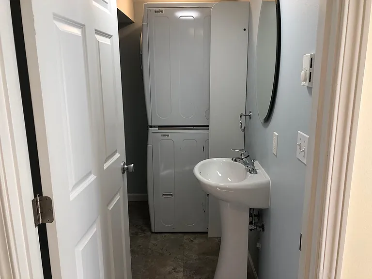 Half bathroom with laundry off entryway