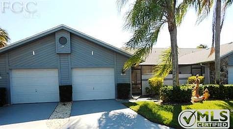 Front entrance to villa.  Courtyard entryway, single car garage.