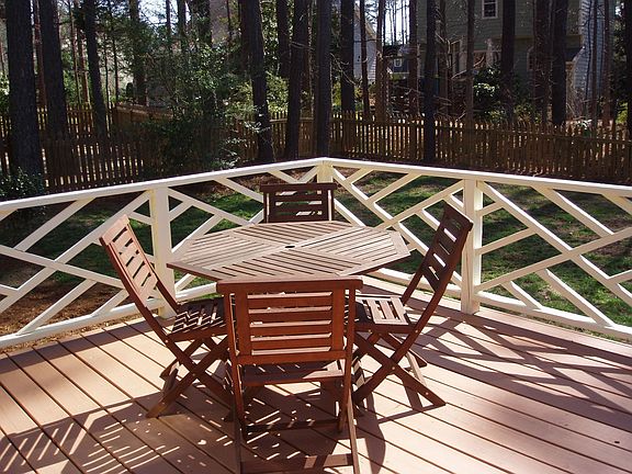 Freshly stained deck, new paint on railing