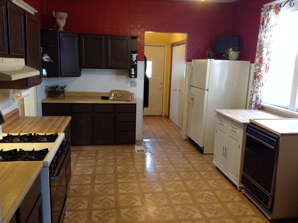 Large and sunny eat-in kitchen connects to both dining and l
