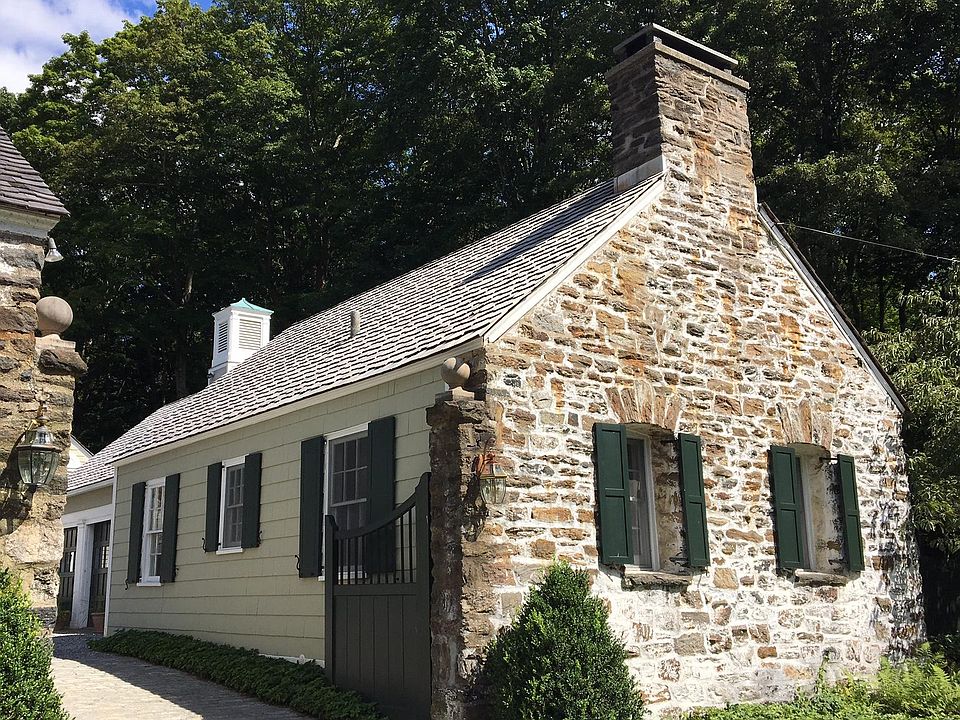 Street view of cottage toward courtyard where we live in a former carriage house on original estate.