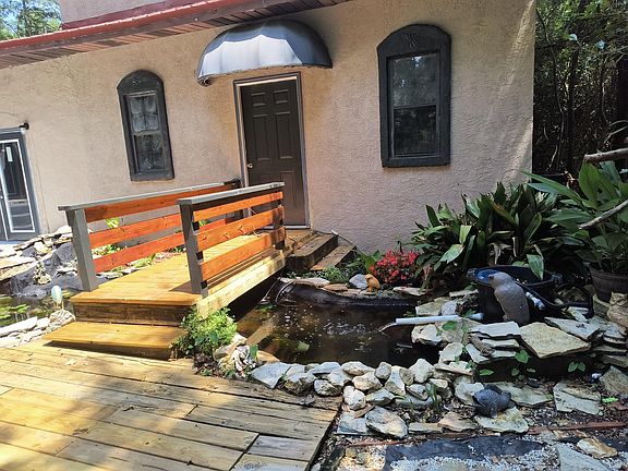 entrance with koi pond to office or gameroom