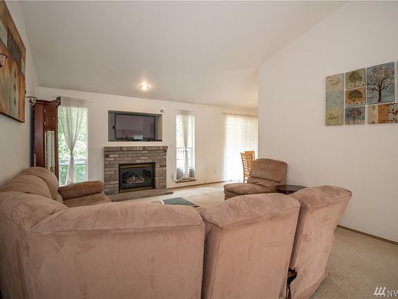 Living Room looking at the Upper Deck and Eat In Kitchen