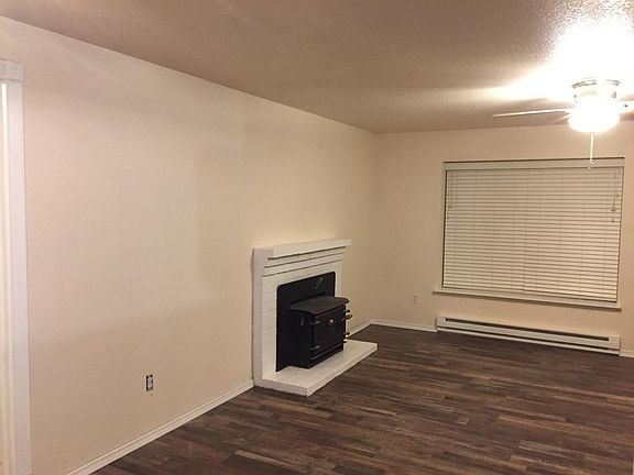 Living room with wood burning fireplace