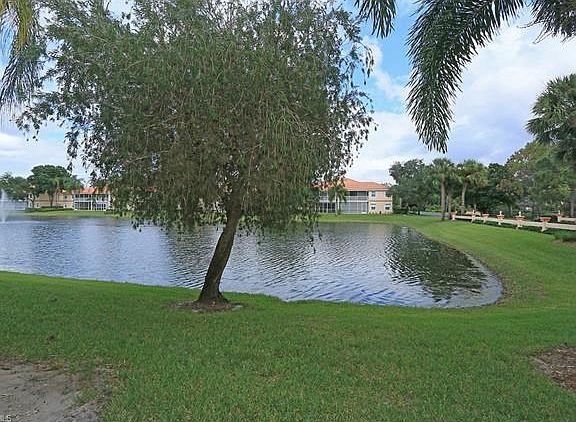 Gorgeous lake, landscaped view from living, master and lanai. Bridge across street with lights...very pretty at night.