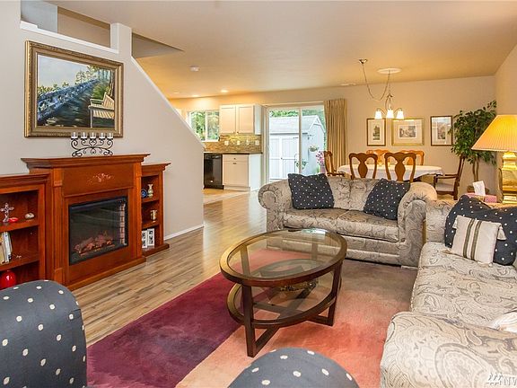 View The Open Concept Living With The Dining Room and Kitchen Near By.