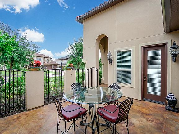 Note, there is wrought iron gate (upper left - actually the gate is open right now so you can't really see it) to the right of the front door. Perfect for catching up with the neighbors with a cup of coffee or a glass of wine. Great cul-de-sac locati