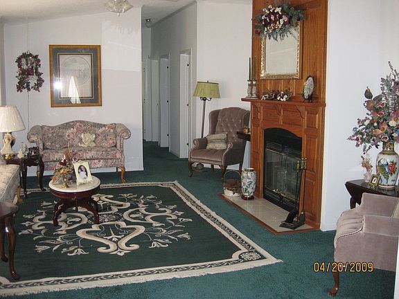 Spacious living room with beautiful gas log fireplace.