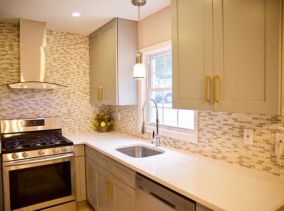 Sunny, designer planned kitchen, Quartz countertops, new cab