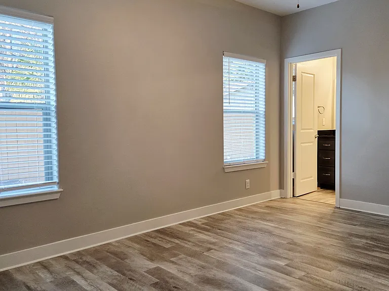 Master bedroom leading into bath.