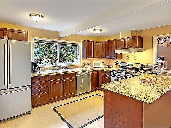 . Kitchen opens to generous dining space. 