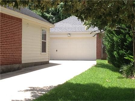 OVERSIZED DETACHED GARAGE. 6' IRON FENCE BETWEEN GARAGE AND HOME