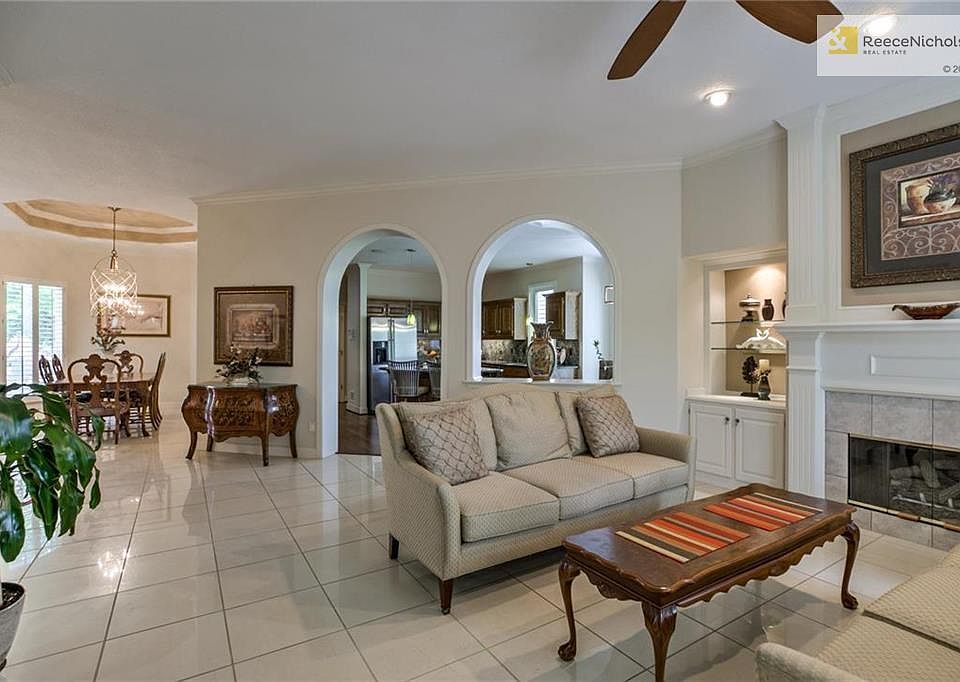 Living Room looking toward front door, dining and kitchen.