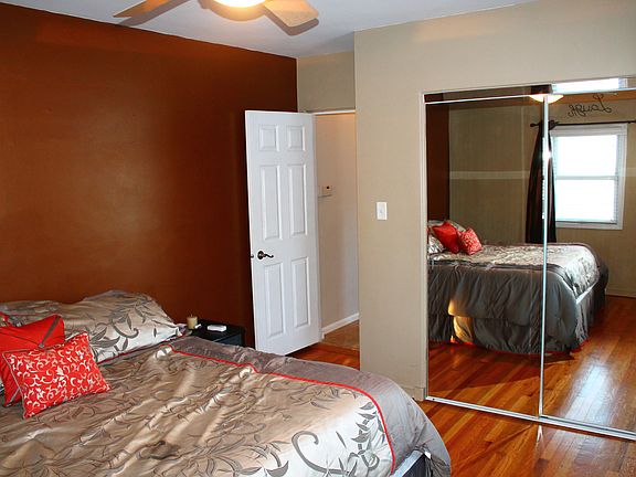 Master bedroom w/ original hardwood.