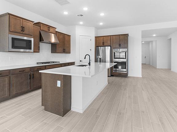Kitchen with dark stained cabinets