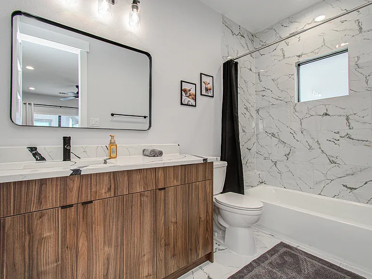 Private en-suite bathroom attached to the second bedroom, offering added comfort, convenience, and privacy for guests.