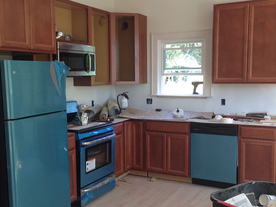 Kitchen (appliances are stainless; protective cover still on