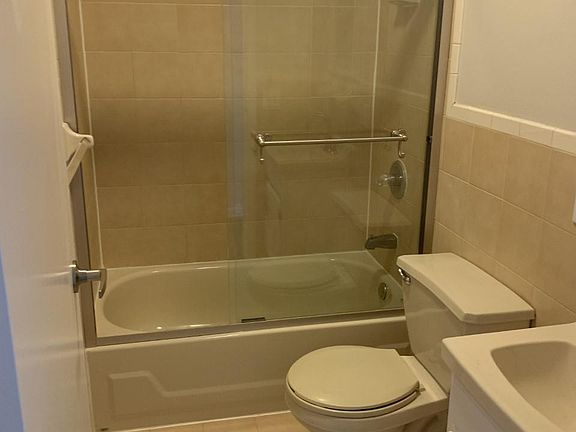 Bathroom Tub and glass shower door
