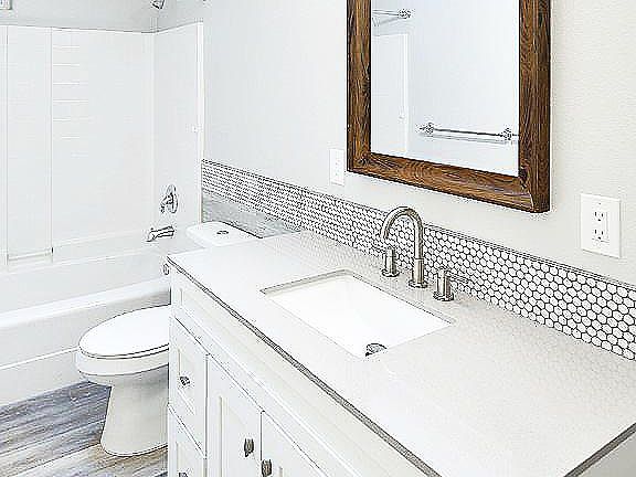 with bathtub and skylight