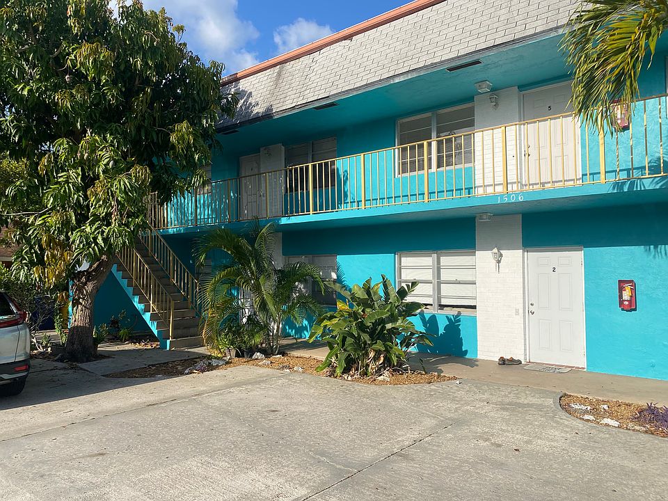 Beautiful tropical landscaping! Two designated parking spaces!
