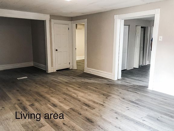 Large living room with 2 closets for storage.