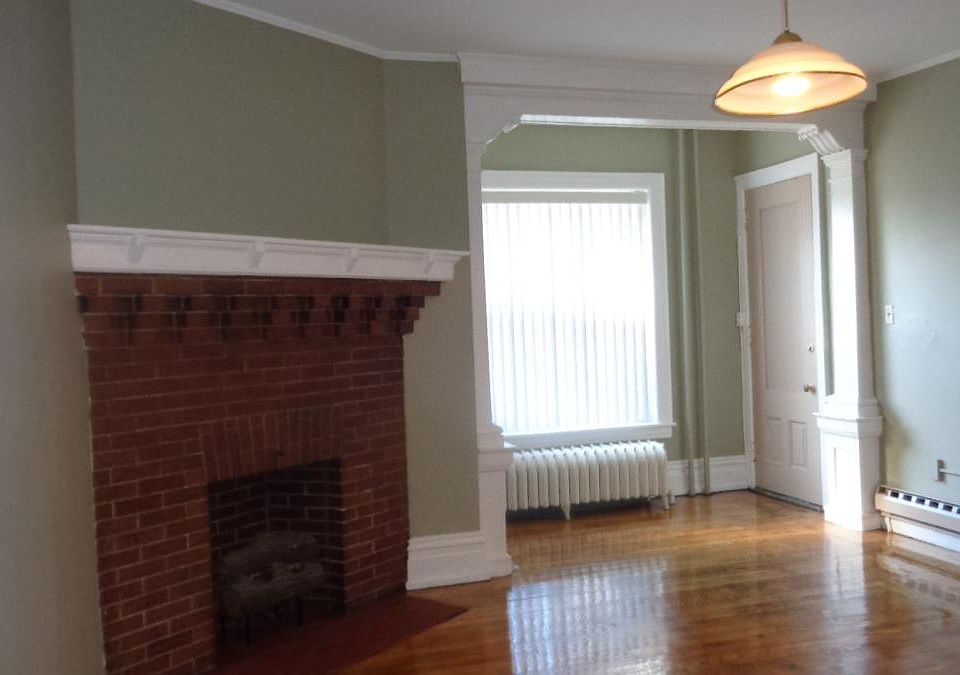 Living Room w/ Hardwood and Fireplace
