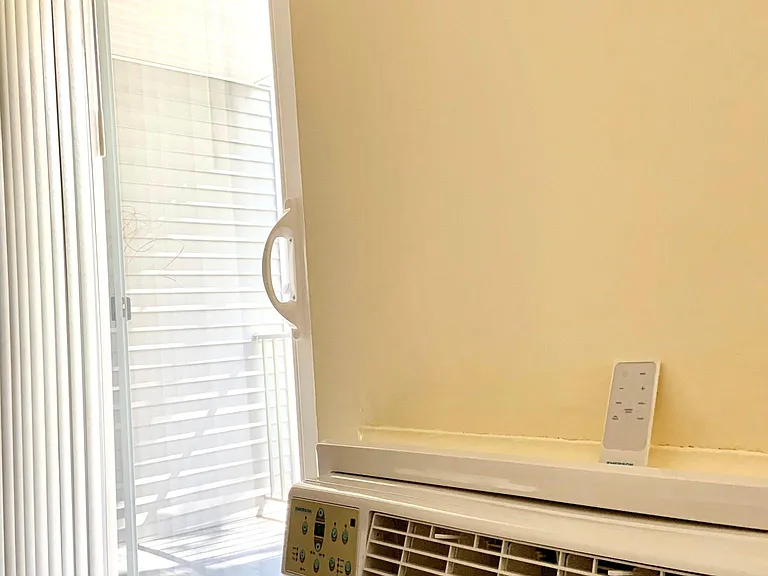 New 12,000 BTU Air Conditioner and Living Room Slider to sunny Terrace