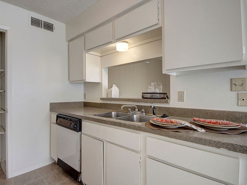 A kitchen with a large pantry and breakfast bar