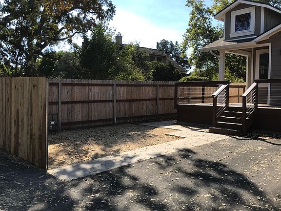 Corner sitting area in yard or expansive/private deck to entertain or just sit and have coffee.