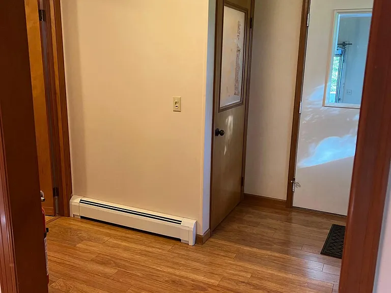 Foyer
Center door goes to basement with etched glass window
to left is entry to bathroom / laundry
to right is pantry
straight ahead is the garage
