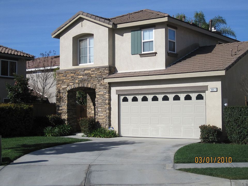 Large driveway and front yard