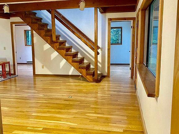 Open doors are to Bedroom #1 & Bedroom #2. A full bath is to the photographer's back.