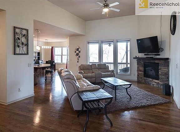 Open concept living room/kitchen dining area with fire place