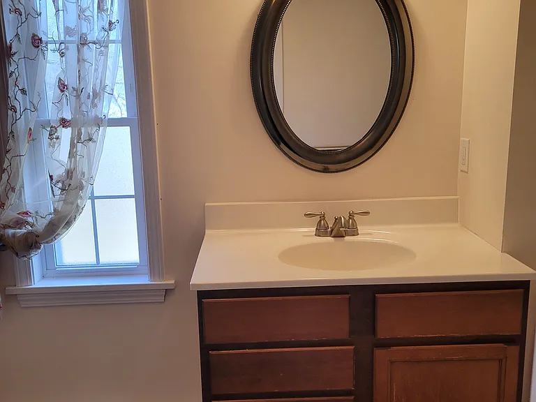 First floor bathroom #1 with shower and washer/dryer hook up near