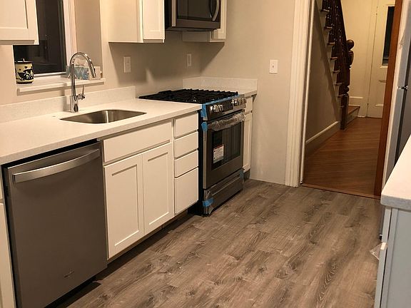 Kitchen view towards front entrance.