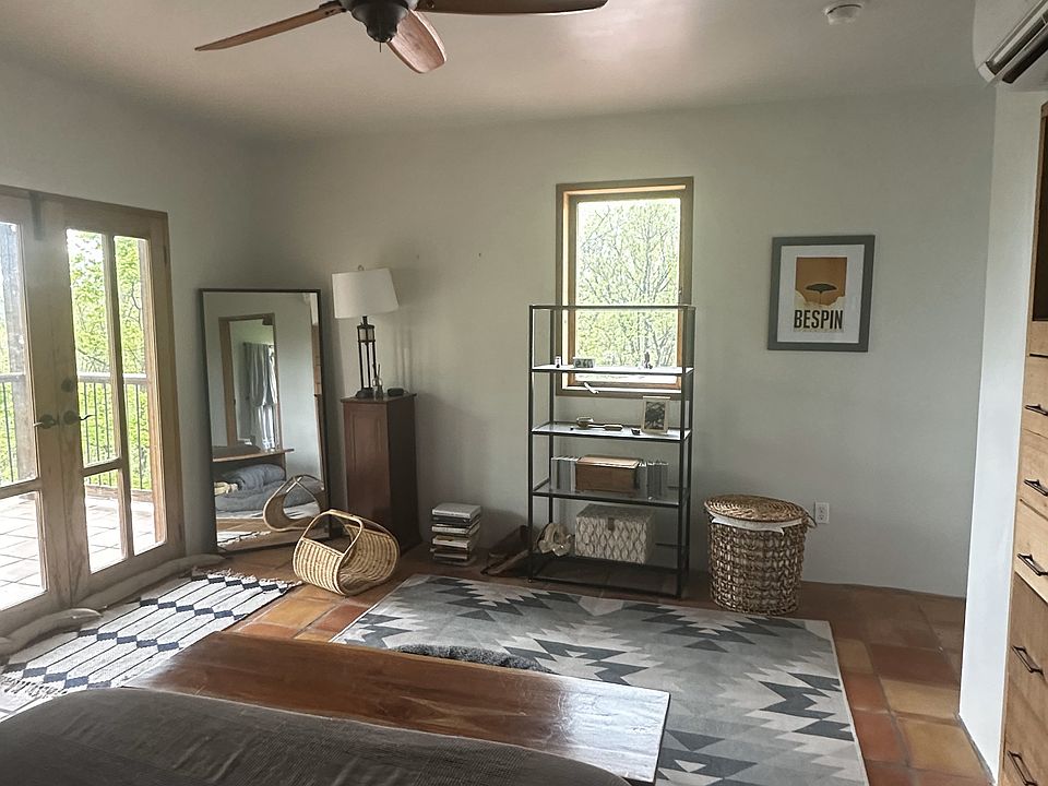 Upstairs (master) bedroom with views and deck facing east.