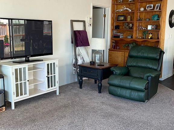 50" TV on a console with internet. The shelving will be emptied.