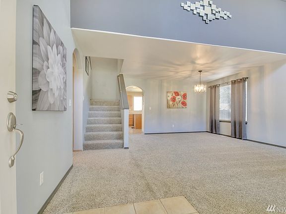Vaulted Entry into formal living room & dining rooms. All new carpet throughout the home.