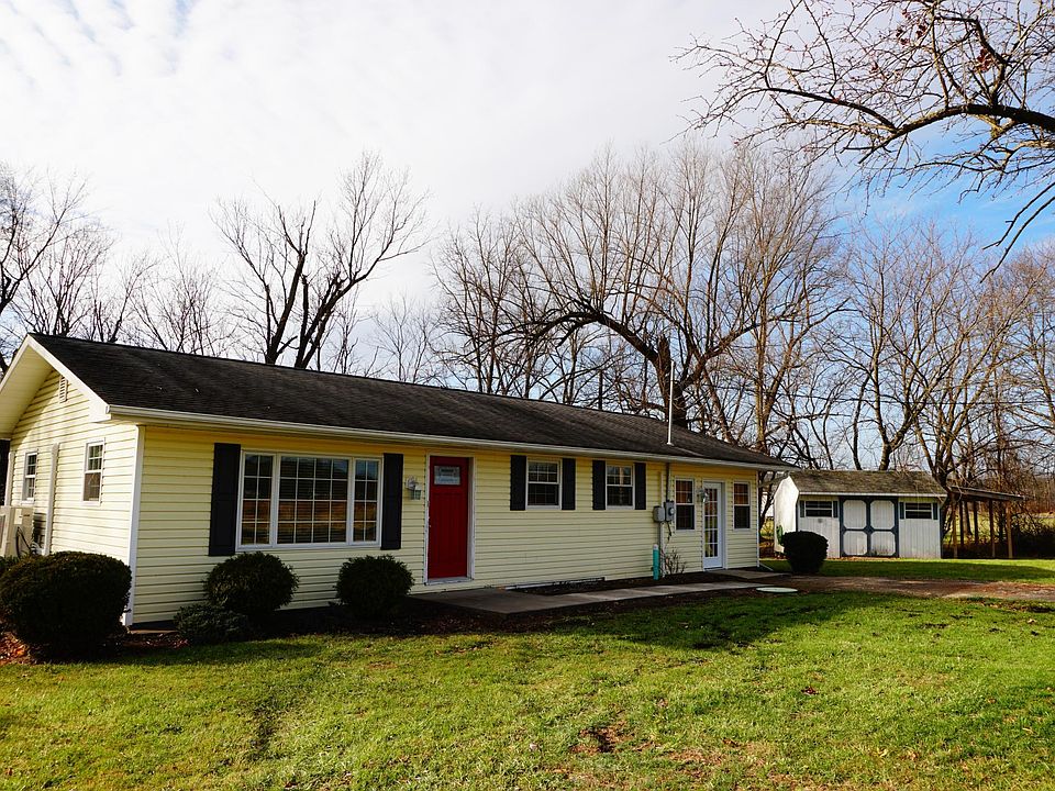 Welcoming one story living with storage shed!