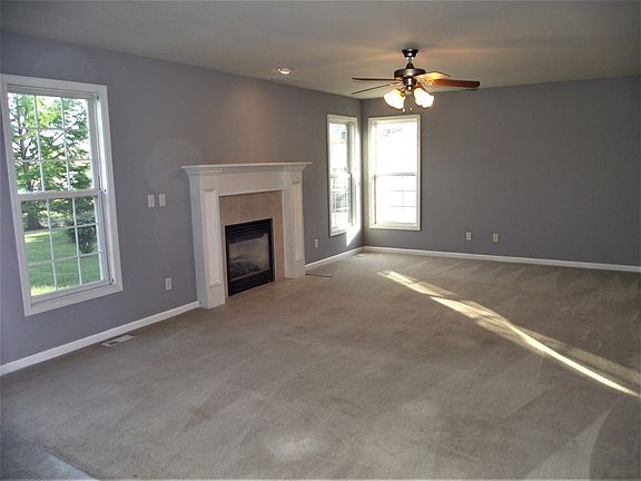 LARGE FAMILY ROOM WITH GAS LOG FIREPLACE OPERATED BY LIGHT SWITCH FOR CONVENIENCE
