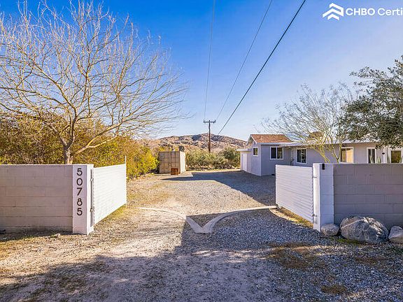 Open, wide double drive secure gated and fenced entry
