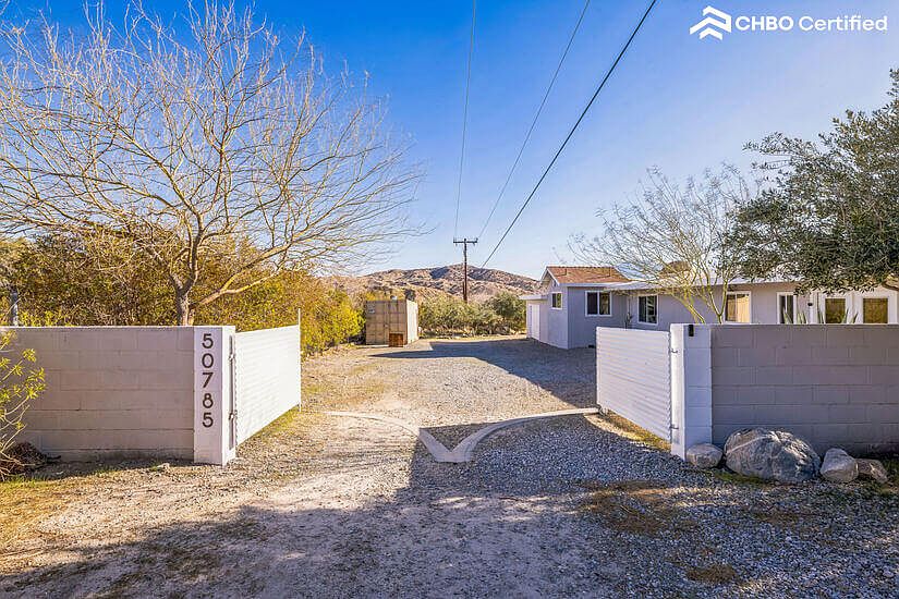 Open, wide double drive secure gated and fenced entry
