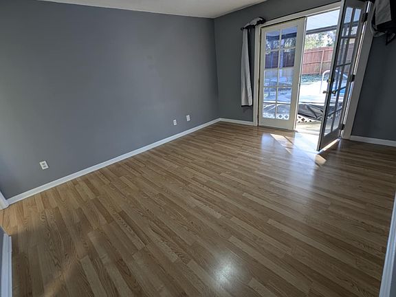 Master bedroom with french doors that faces the pool.