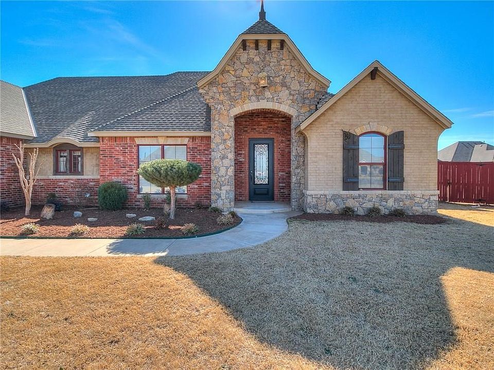 Beautiful curb appeal with gorgeous landscaping and the rock entry.