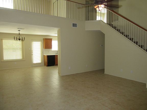 View from entry of living room to upstairs game room